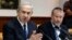 Israel's Prime Minister Benjamin Netanyahu (L) speaks during the weekly cabinet meeting in Jerusalem, May 19, 2013. 