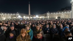 Catholic faithful attend a nightly rosary prayer for the health of Pope Francis in St. Peter's Square at the Vatican, March 2, 2025. 