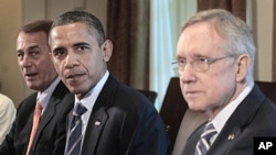 President Barack Obama, flanked by House Speaker John Boehner (l) and Senate Majority Leader Harry Reid, meets with Congressional leadership in the Cabinet Room of the White House, July 7, 2011