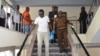 FILE - Tanzanian investigative journalist Erick Kabendera leaves after he appeared at the Kisutu residents magistrate court in Dar es Salaam, Tanzania, Sept. 12, 2019.