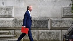 FILE - Britain's Foreign Secretary Dominic Raab leaves the Foreign and Commonwealth Office in central London, July 1, 2020.