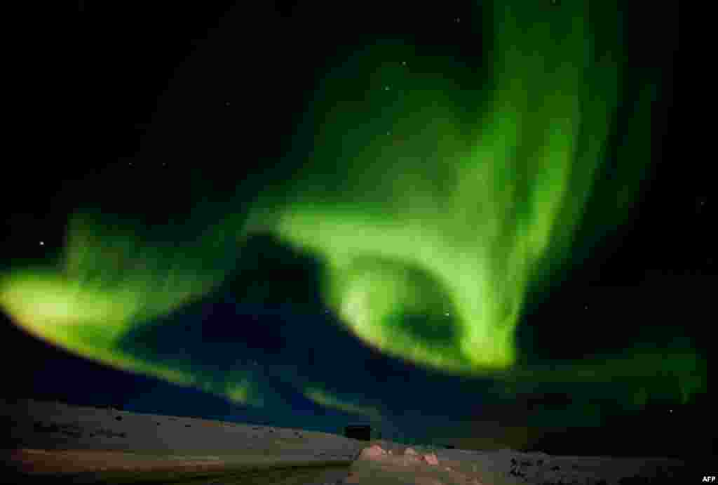 March 13: Northern lughts fill the sky over Finnmark during the Finnmarkslopet, world's northernmost sled dog race, in Norway. (Reuters/Tore Meek)