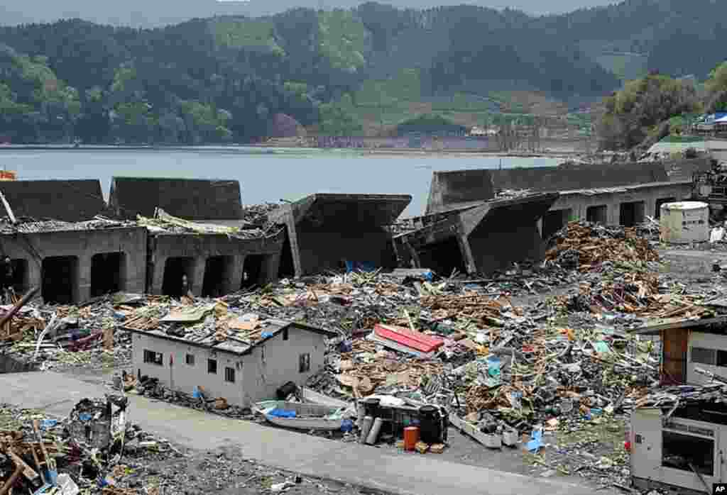 The 12-metre-tall breakwater is seen broken and nearly collapsed by the March 11 tsunami in the Toni area of the tsunami-devastated city of Kamaishi, Iwate prefecture. Some 10,808 people were still listed as missing as of May 2, with 14,728 confirmed dead