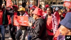 Protesters from various trade unions gather at the government's Union Buildings in Pretoria, South Africa, Wednesday Aug. 24 2022. Workers have demonstrated against the country's rising cost of living including record-high fuel prices and increased costs for basic foods