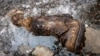 A boot and a sock are discovered on the Central Rongbuk Glacier below the North Face of Mount Everest, Oct. 11, 2024. (Jimmy Chin/National Geographic via AP)