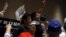 Protesters shout as they are escorted out of the building during U.S. Republican presidential candidate Donald Trump's campaign rally at the Tampa Convention Center in Tampa, Florida March 14, 2016. 