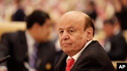 FILE - the President of Yemen Abed Rabbo Mansour Hadi, participates in a summit of Arab and South American leaders in Riyadh, Saudi Arabia.