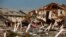 An American flag flies amongst rubble left in the aftermath of Hurricane Michael in Mexico Beach, Florida, Oct. 11, 2018. 