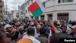 FILE - Madagascar's opposition member and presidential candidate Jean Jacques Ratsietison is surrounded by supporters after police fired tear gas to disperse demonstrators attending his rally, in Antananarivo, Madagascar November 4, 2023.