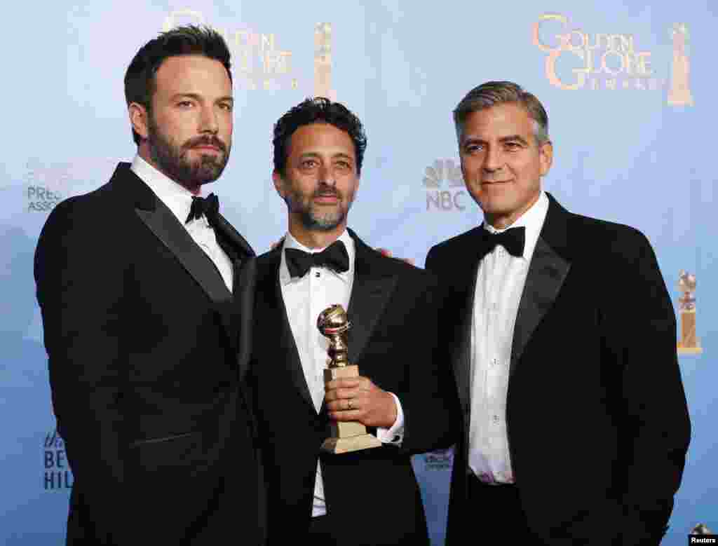 Producer and director Ben Affleck (L) poses with "Argo" producers Grant Heslov (C) and George Clooney after Affleck won Best Director and "Argo" won the award for Best Motion Picture Drama at the 70th annual Golden Globe Awards in Beverly Hills, Californi