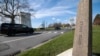 A passenger vehicle drives past a border marker as it enters Canada from the United States at the Peace Arch crossing in Blaine, Washington, on March 5, 2025.