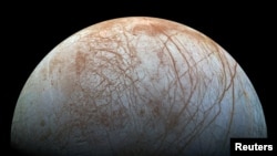 FILE - A view of Jupiter's moon Europa created from images taken by NASA's Galileo spacecraft in the late 1990s. (NASA/JPL-Caltech/SETI Institute/ Handout via REUTERS)