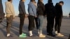 This image released by the U.S. Department of Defense shows shackled undocumented migrants preparing to board a C-17 Globemaster III at Fort Bliss, Texas, Jan. 23, 2025. (AFP/ DVIDS / Department of Defense / US Army Sgt. 1st Class Nicholas J. De La Pena)