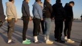 This image released by the U.S. Department of Defense shows shackled undocumented migrants preparing to board a C-17 Globemaster III at Fort Bliss, Texas, Jan. 23, 2025. (AFP/ DVIDS / Department of Defense / US Army Sgt. 1st Class Nicholas J. De La Pena)