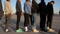 This image released by the U.S. Department of Defense shows shackled undocumented migrants preparing to board a C-17 Globemaster III at Fort Bliss, Texas, Jan. 23, 2025. (AFP/DVIDS/Department of Defense/U.S. Army Sgt. 1st Class Nicholas J. De La Pena)