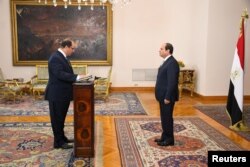 Egyptian President Abdel Fattah al-Sisi (R) listens to the swearing in of Major General Abbas Kamel, newly appointed chief of the country's General Intelligence Service at the Ittihadiya presidential palace in Cairo, Egypt, June 28, 2018.