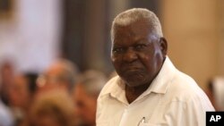 FILE — Cuba's National Assembly President Esteban Lazo attends a mass at the Cathedral in Havana, Cuba, July 28, 2019.