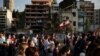 People march in honor of the victims of the last week's explosion that killed over 150 people and devastated the city, near the blast site in Beirut, Lebanon, Aug. 11, 2020.