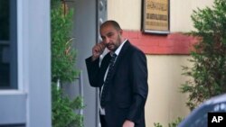 A security guard walks outside Saudi Arabia's consulate in Istanbul, Oct. 20, 2018. Saudi Arabia claims Saudi journalist Jamal Khashoggi died in a "fistfight" in the consulate, finally admitting that the writer had been slain at its diplomatic post.