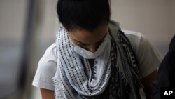 A traveller wearing a mask at Johannesburg's OR Tambo International Airport, March 1, 2020. 