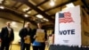 FILE - In this March 15, 2016, file photo, people line up to vote in the primary at a precinct in Bradfordton, Il. 