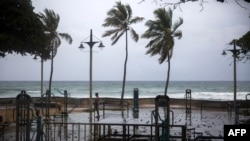 A man exercises under pouring rain during Tropical Storm Isaias in Santo Domingo, Dominican Republic, July 30, 2020. 