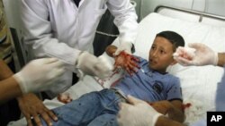 A Palestinian schoolboy injured in the blast receives treatment at a hospital in the southern Gaza strip town of Rafah, 20 Oct 2010