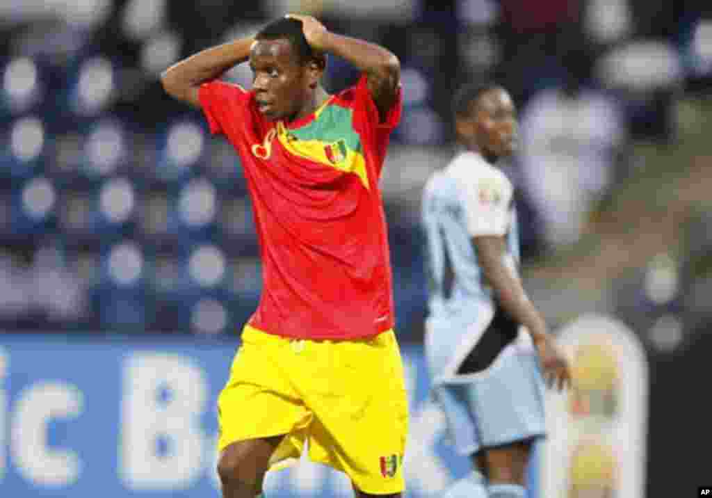 Guinea's Ibrahim Traore (L) reacts during their African Nations Cup Group D soccer match against Botswana at Franceville Stadium January 28, 2012.