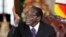 Zimbabwean President Robert Mugabe holds a news conference after the swearing-in of ministers at the State House in Harare, Sept. 11, 2013. 