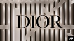 FILE - The Dior logo is seen on a storefront in Boston, Massachusetts, on Nov. 8, 2022. Dior has "postponed indefinitely" a fashion show scheduled to be held in Hong Kong in March 2024.