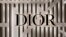 FILE - The Dior logo is seen on a storefront in Boston, Massachusetts, on Nov. 8, 2022. Dior has "postponed indefinitely" a fashion show scheduled to be held in Hong Kong in March 2024.