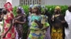 Schoolgirls, who escaped from Boko Haram kidnappers in the village of Chibok, arrive at the Government house to speak with State Governor Kashim Shettima, in Maiduguri, Nigeria, June 2, 2014.