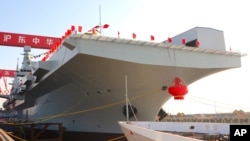 In this photo released by Xinhua News Agency, China's first Type 076 new-generation amphibious assault ship, the Sichuan, is seen in Shanghai, Dec 27, 2024. (Li Yun/Xinhua via AP)