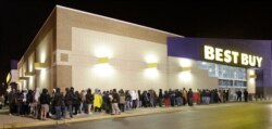 File -- Hundreds of shoppers line up for Black Friday deals at Best Buy in Mayfield Heights, Ohio.