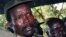FILE - The leader of the Lord's Resistance Army, Joseph Kony, answers journalists' questions following a meeting with UN officials in southern Sudan, November 2006.