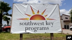 FILE - A Southwest Key Programs sign is displayed on June 20, 2014, in Brownsville, Texas. The U.S. Justice Department has ended a civil rights lawsuit against the nonprofit, a March 2025 court filing says.