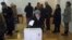 A woman casts her ballot at a polling station during the presidential election in Zagreb December 28, 2014. Croats were voting for a new head of state on Sunday but none of the four candidates for the largely ceremonial post in the European Union's newest