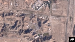 FILE - This satellite photo from Planet Labs PBC shows damaged buildings at Iran's Parchin military base outside of Tehran, Oct. 27, 2024.