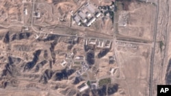 This satellite photo from Planet Labs PBC shows damaged buildings at Iran's Parchin military base outside of Tehran, Oct. 27, 2024. (Planet Labs PBC via AP)