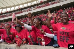 FILE - Supporters of Economic Freedom Fighters leader Julius Malema, welcome him upon his arrival at Moses Mabhida Stadium in KwaZulu Natal province, South Africa, February 10, 2024.