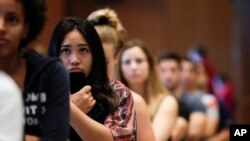 FILE - Students at San Diego State University watch a video on sexual consent during an orientation meeting in San Diego, California, Aug. 1, 2014.