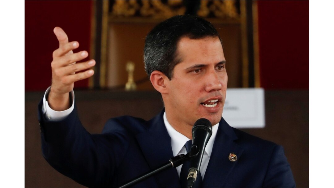 Venezuelan opposition leader Juan Guaido, who many nations have recognized as the country's rightful interim ruler, gestures as he speaks during a session of Venezuela's National Assembly at a public square in Caracas, July 23, 2019..
