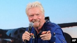FILE - In this July 11, 2021 file photo, Richard Branson answers students' questions during a news conference at Spaceport America near Truth or Consequences, N.M.