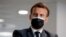 French President Emmanuel Macron visits a call center of the French Social security insurance dedicated to Covid-19 vaccinations, March 29, 2021 in Creteil, outside Paris.