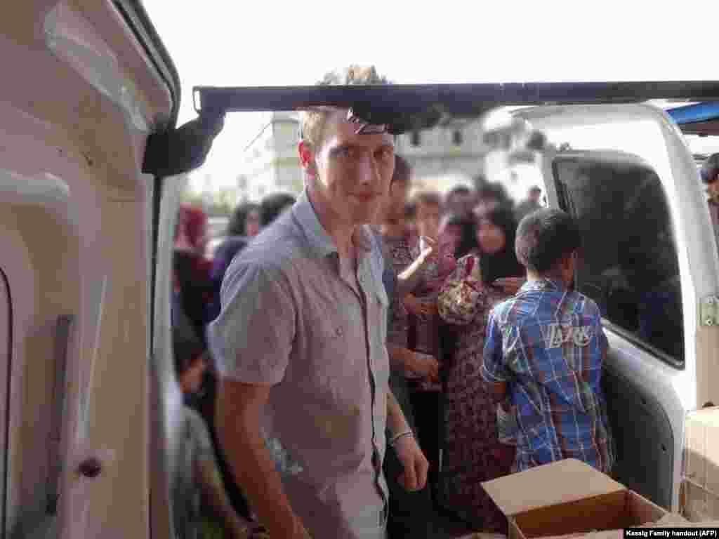 Abdul-Rahman Kassig is shown in a Kassig family photo somewhere along the Syrian border between late 2012 and autumn 2013, helping Special Emergency Response and Assistance (SERA) deliver supplies to refugees.