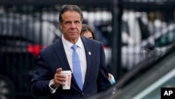 FILE - New York Gov. Andrew Cuomo prepares to board a helicopter after announcing his resignation, Aug. 10, 2021, in New York.