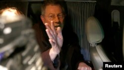 UN special envoy Robert Serry gestures as he leaves in a car in Simferopol March 5, 2014.