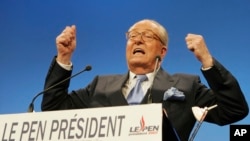 FILE - French far-right leader and presidential candidate Jean-Marie Le Pen gestures as he delivers a speech after the announcement of the preliminary official results of the election's first round, Apr. 22, 2007, in Paris.