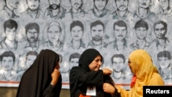 FILE - Relatives of missing Kashmiri men attend a sit-in protest in a park organized by the Association of Parents of Disappeared Persons (APDP) in Srinagar, Oct. 10, 2013.