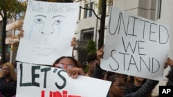 Washington public school students protest near Trump International Hotel in downtown Washington, Tuesday, Nov. 15, 2016. Hundreds of students in the nation's capital walked out of class and headed downtown to protest President-elect Donald Trump. In the South Sudan, a pro-Trump march was postponed due to a lack of funds. 